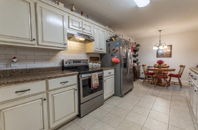 kitchen with pendant lighting, light tile patterned floors, stainless steel appliances, a notable chandelier, and decorative backsplash