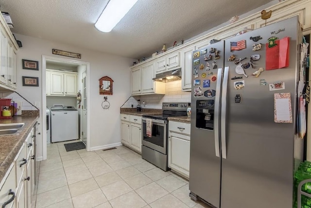 kitchen with light tile patterned floors, sink, appliances with stainless steel finishes, tasteful backsplash, and washer / clothes dryer