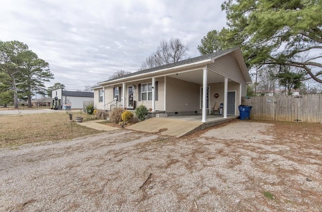 view of front of home featuring a carport