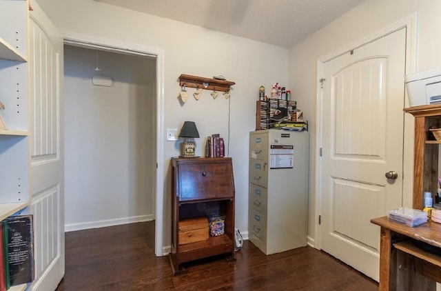 interior space with dark hardwood / wood-style floors and beverage cooler