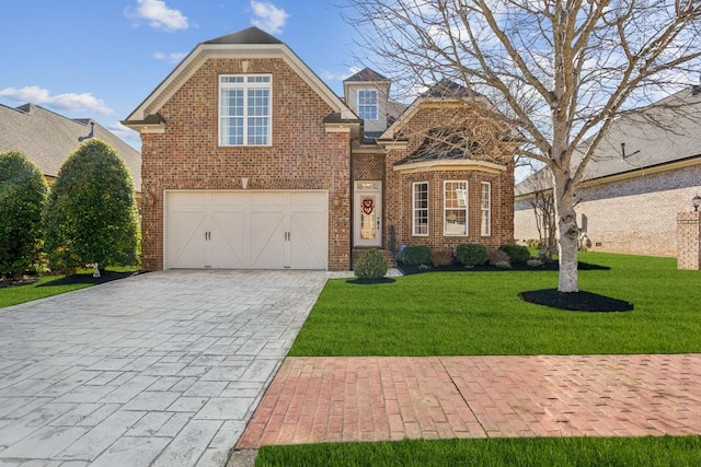 view of property with a garage and a front yard