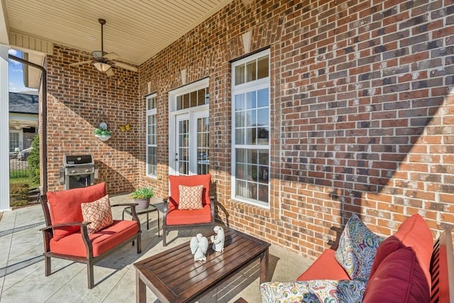 view of patio / terrace with an outdoor living space, grilling area, and ceiling fan