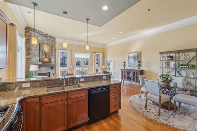 kitchen featuring sink, decorative light fixtures, dishwasher, and range