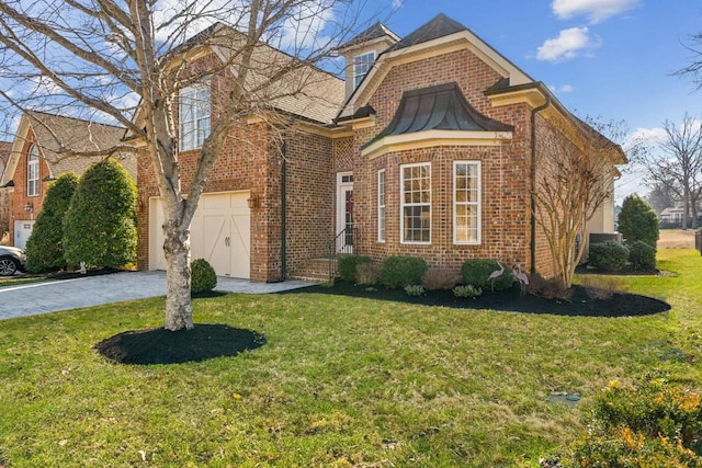 view of front property with a garage and a front lawn