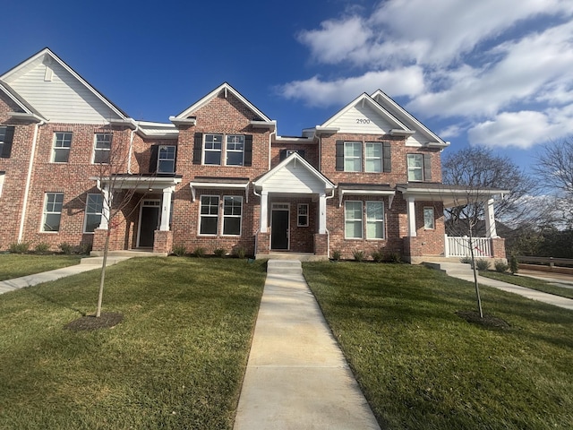 view of front of home with a front lawn