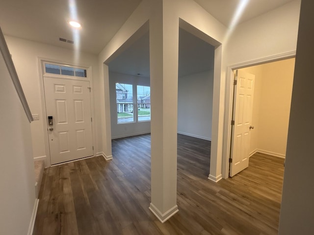 foyer with dark hardwood / wood-style floors