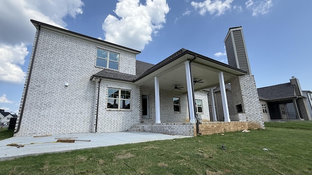 839 Stovers Gln, Murfreesboro, TN 37128 - back of property featuring a ceiling fan, brick siding, a yard, a chimney, and a patio