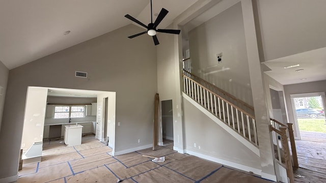 839 Stovers Gln, Murfreesboro, TN 37128 - unfurnished living room featuring high vaulted ceiling, ceiling fan, and stairs