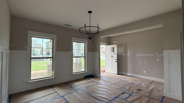 839 Stovers Gln, Murfreesboro, TN 37128 - unfurnished dining area with a wainscoted wall and a chandelier