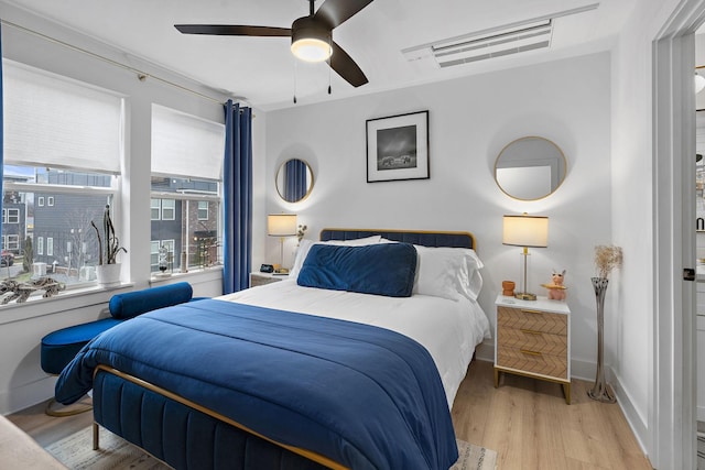 bedroom featuring ceiling fan and light hardwood / wood-style floors