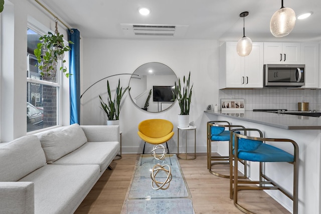 living room featuring light wood-type flooring