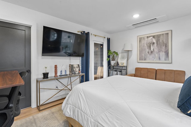 bedroom featuring light wood-type flooring