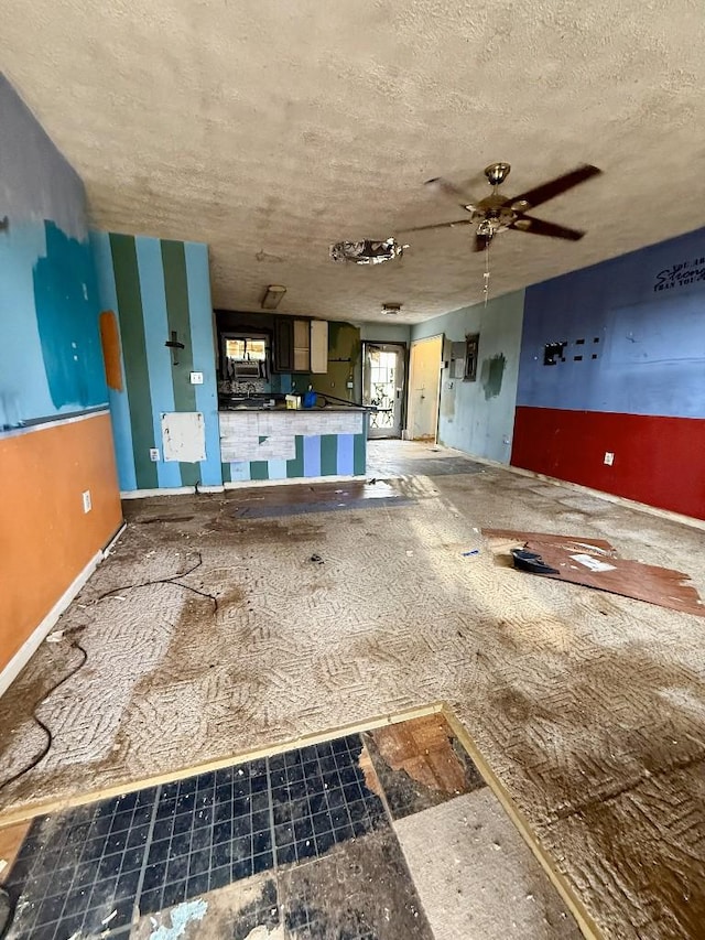 miscellaneous room with a textured ceiling