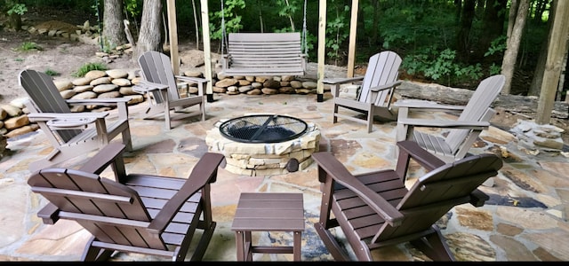 view of patio with an outdoor fire pit