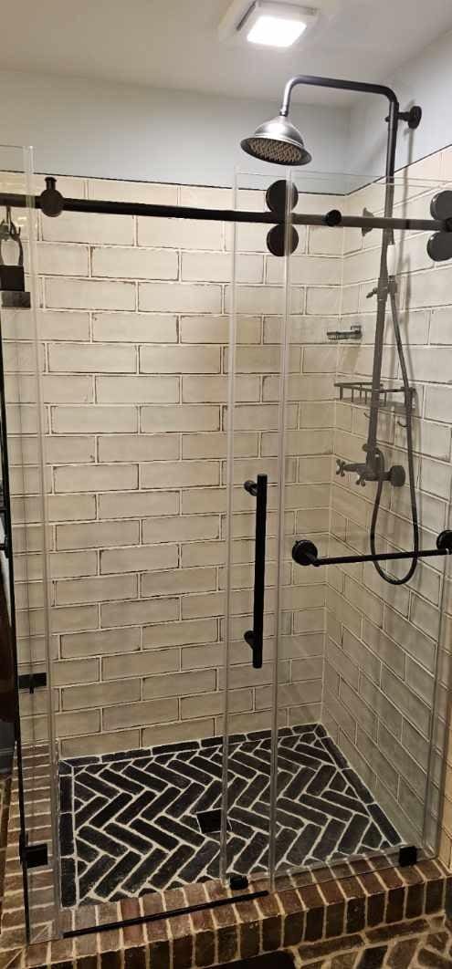 bathroom featuring a shower stall