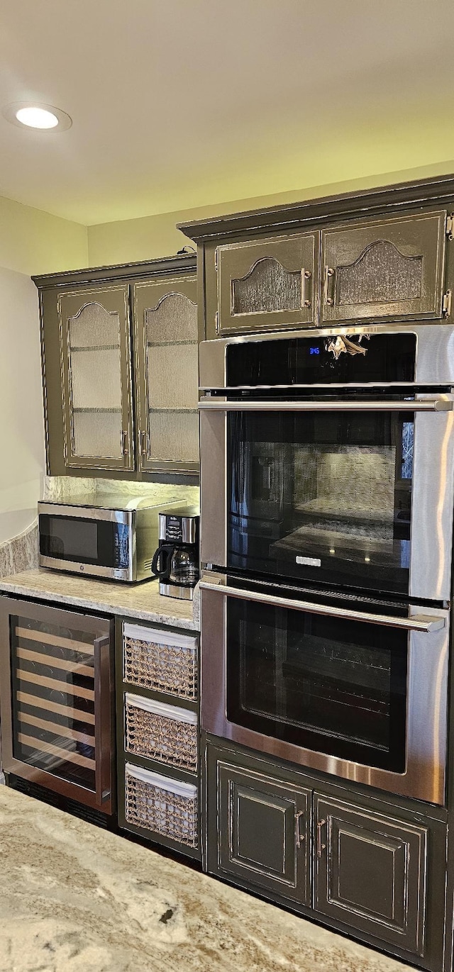 room details featuring wine cooler and appliances with stainless steel finishes