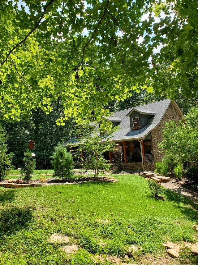 view of yard with covered porch