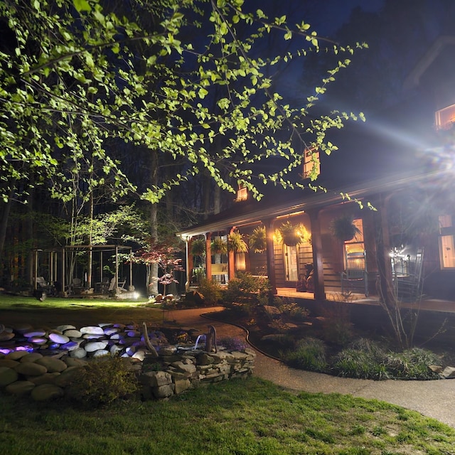 view of back of house at twilight