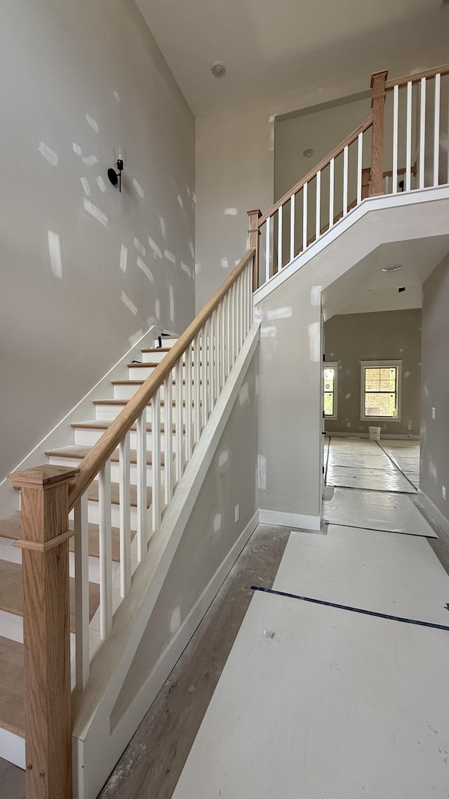 835 Stovers Gln, Murfreesboro, TN 37128 - stairway featuring a towering ceiling and baseboards