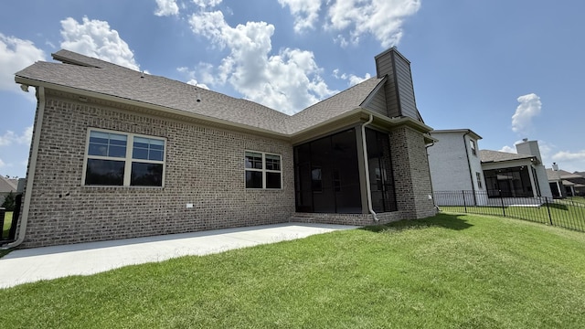 835 Stovers Gln, Murfreesboro, TN 37128 - back of house featuring a sunroom, brick siding, a chimney, a shingled roof, and a patio