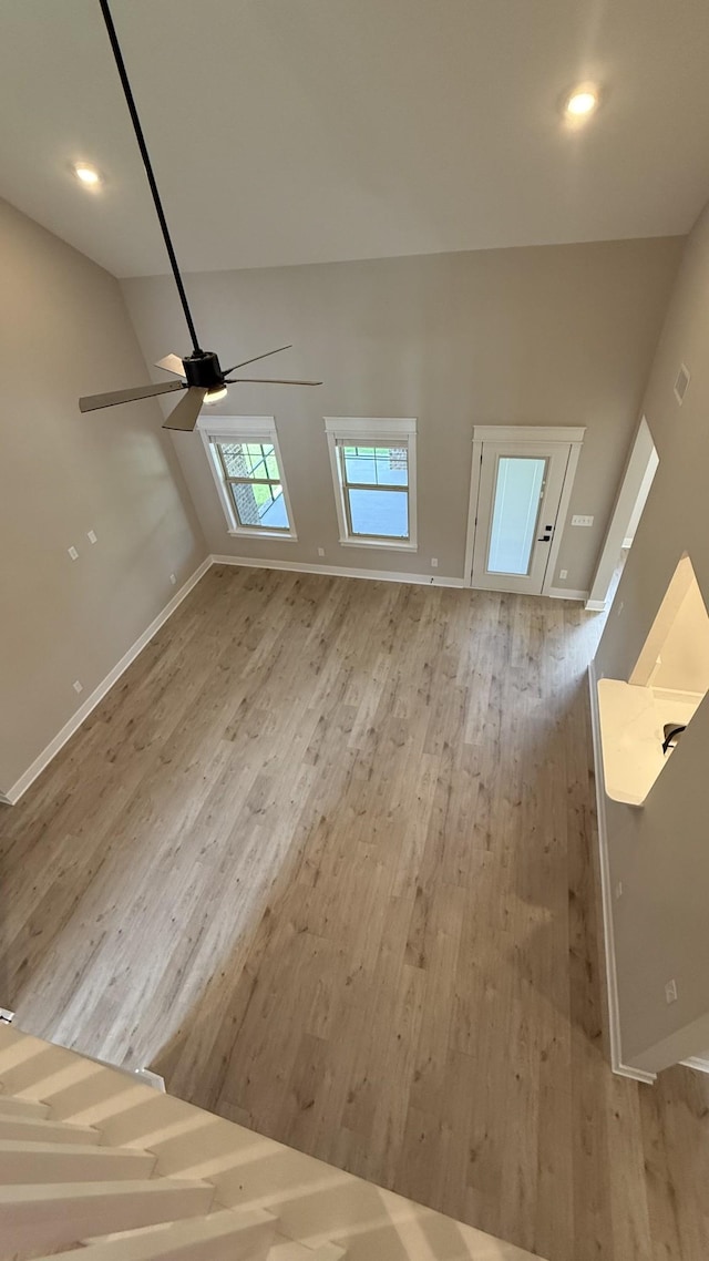 835 Stovers Gln, Murfreesboro, TN 37128 - unfurnished living room with light wood finished floors, a ceiling fan, and recessed lighting