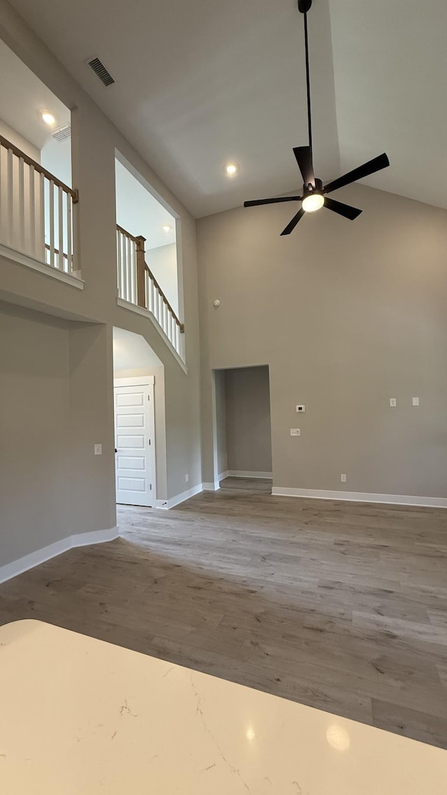 835 Stovers Gln, Murfreesboro, TN 37128 - unfurnished living room with a towering ceiling, a ceiling fan, wood finished floors, and recessed lighting