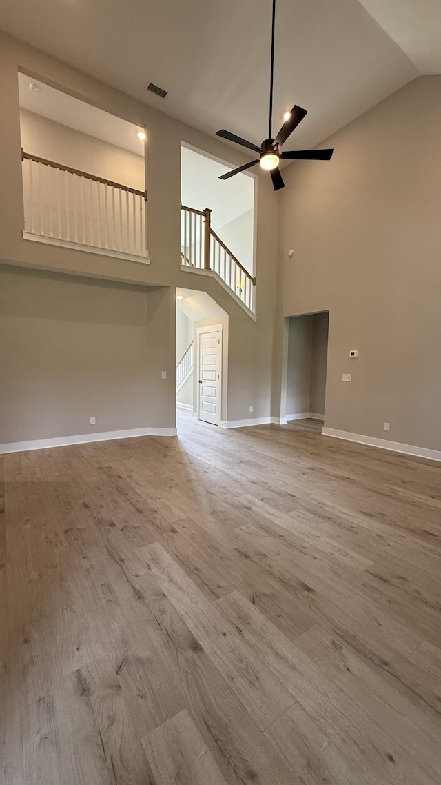 835 Stovers Gln, Murfreesboro, TN 37128 - unfurnished living room featuring high vaulted ceiling, wood finished floors, and ceiling fan