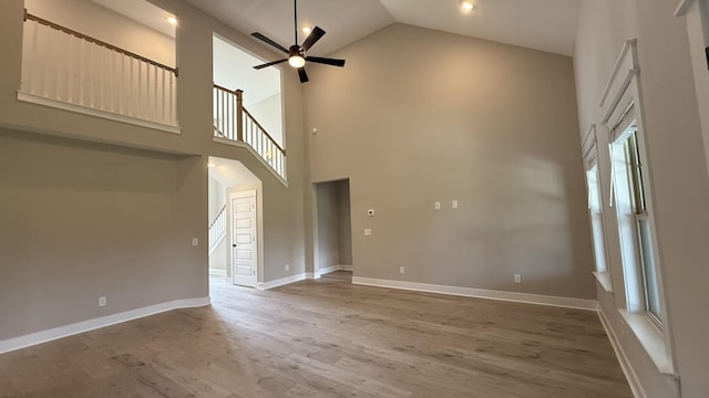 835 Stovers Gln, Murfreesboro, TN 37128 - unfurnished living room featuring high vaulted ceiling, ceiling fan, and wood finished floors
