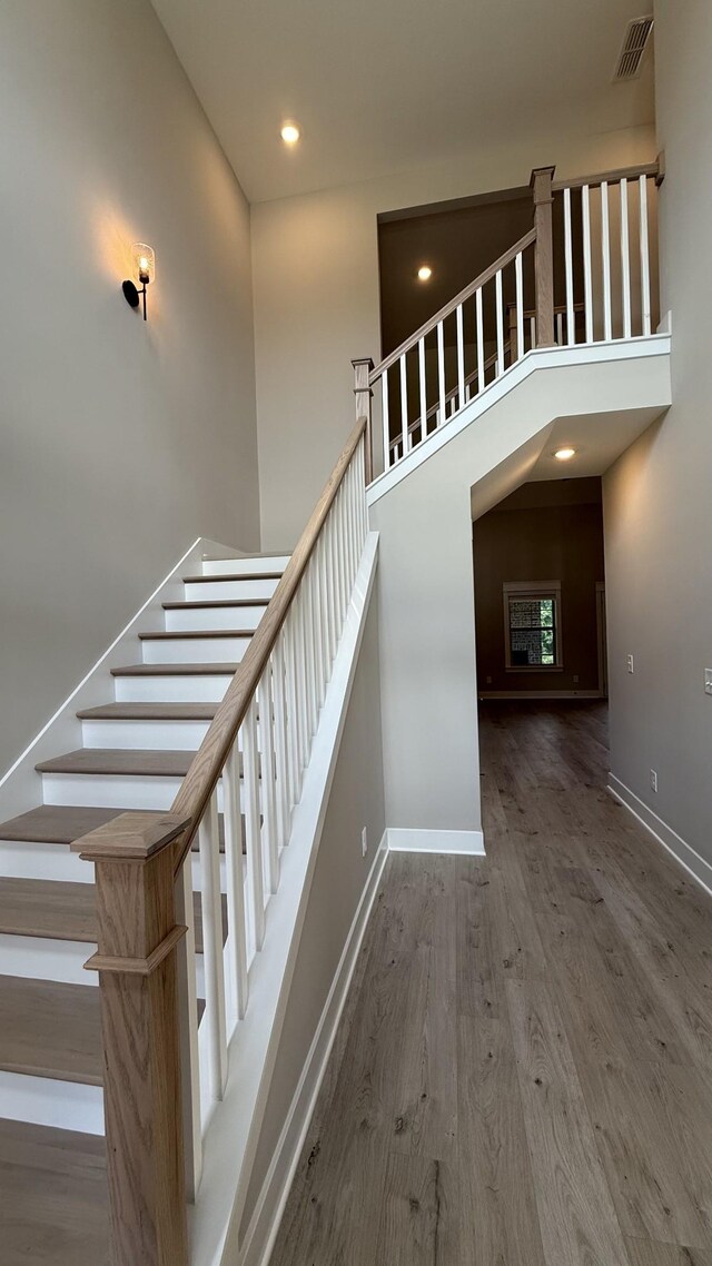 835 Stovers Gln, Murfreesboro, TN 37128 - staircase featuring wood finished floors, recessed lighting, and a high ceiling