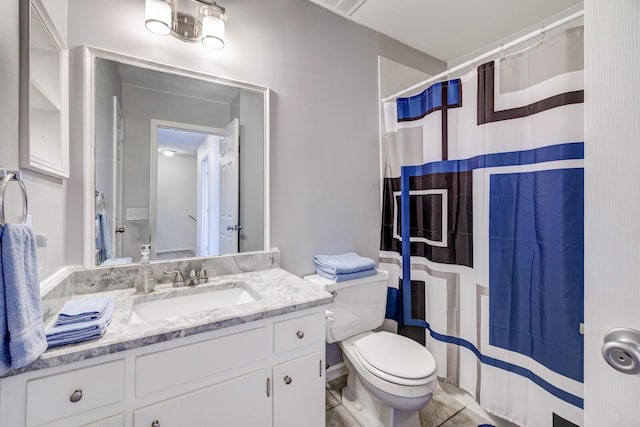 bathroom featuring vanity, curtained shower, and toilet