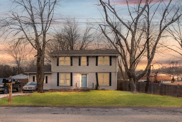 view of front of home with a lawn