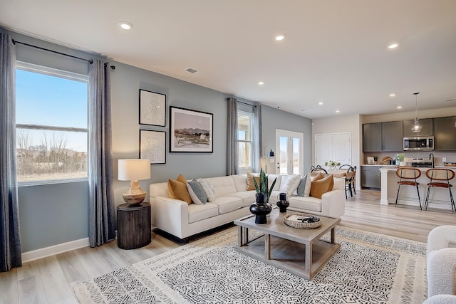 living room with light hardwood / wood-style floors