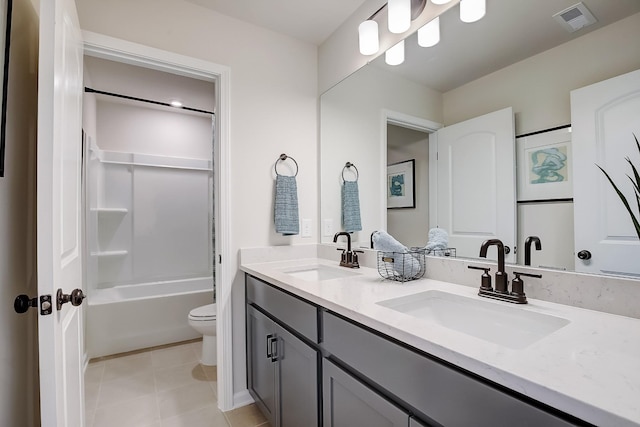 full bathroom featuring vanity, tile patterned flooring, bathtub / shower combination, and toilet