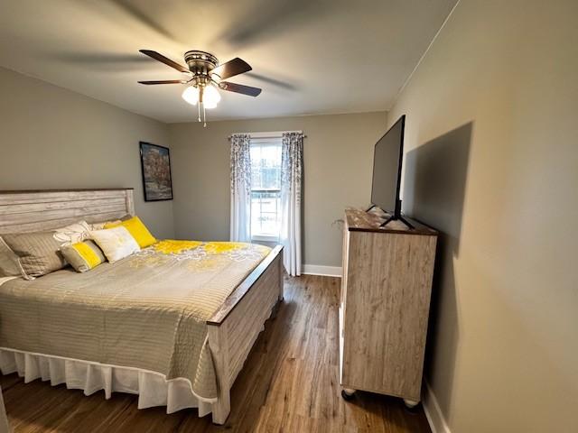 bedroom featuring hardwood / wood-style flooring and ceiling fan