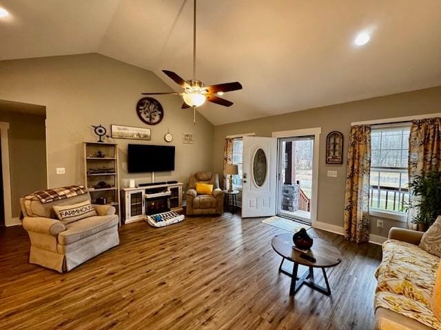 living room featuring ceiling fan, lofted ceiling, and dark hardwood / wood-style flooring