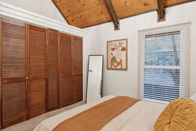 bedroom featuring wood ceiling, a closet, and vaulted ceiling with beams