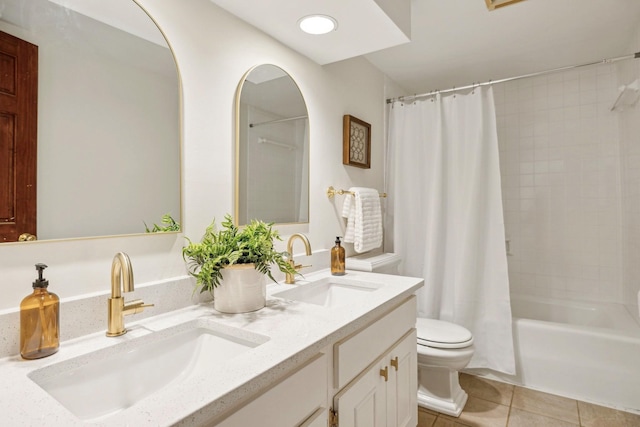 full bathroom featuring vanity, tile patterned floors, toilet, and shower / bath combo with shower curtain