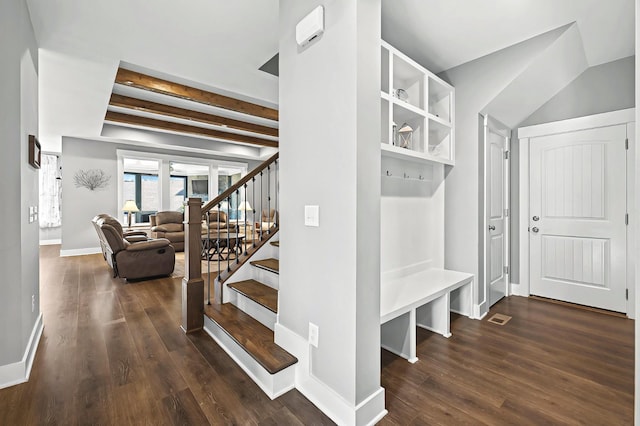 mudroom featuring dark hardwood / wood-style flooring and beam ceiling