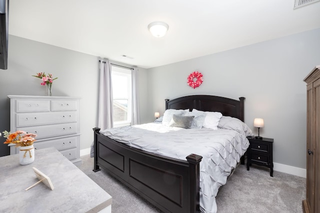 bedroom featuring light carpet