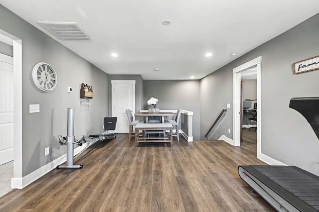 workout area featuring dark hardwood / wood-style floors