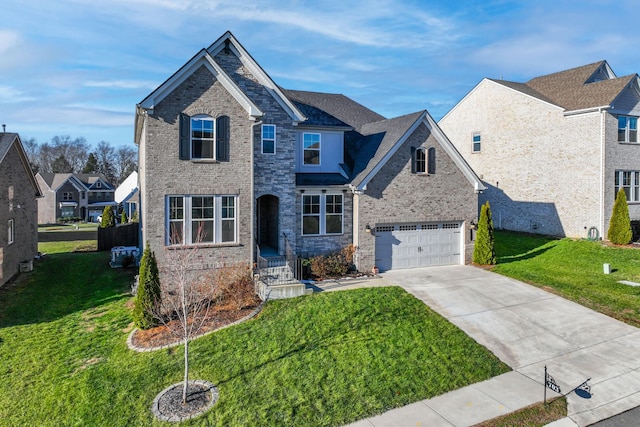 view of front facade with a garage and a front lawn