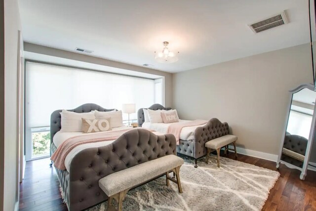 2122 9th Ave N, Nashville, TN 37208 - bedroom with dark hardwood / wood-style floors and a notable chandelier