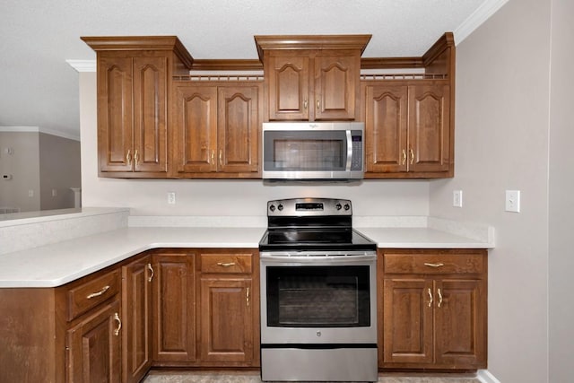 kitchen featuring crown molding and appliances with stainless steel finishes