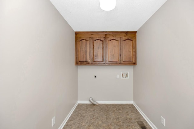 laundry room featuring electric dryer hookup, cabinets, washer hookup, a textured ceiling, and light carpet