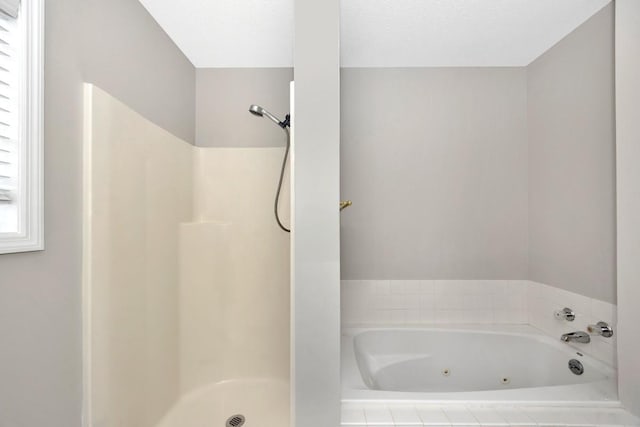 bathroom with a textured ceiling and a shower