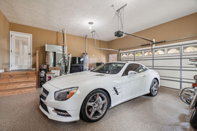 garage with a garage door opener and water heater