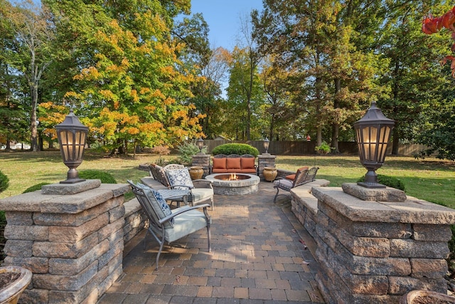 view of patio with an outdoor fire pit