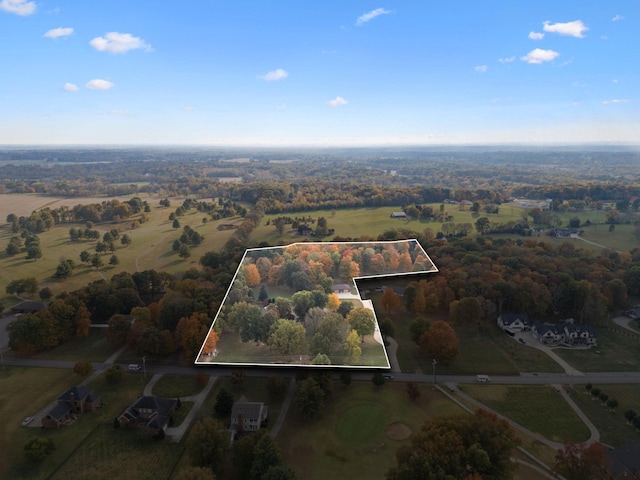 birds eye view of property with a rural view