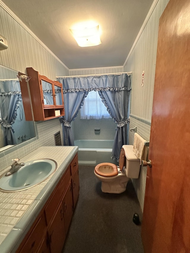 full bathroom with crown molding, shower / tub combo with curtain, vanity, and toilet