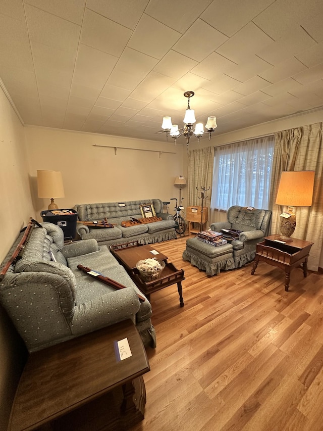 living room featuring light wood-type flooring and a notable chandelier